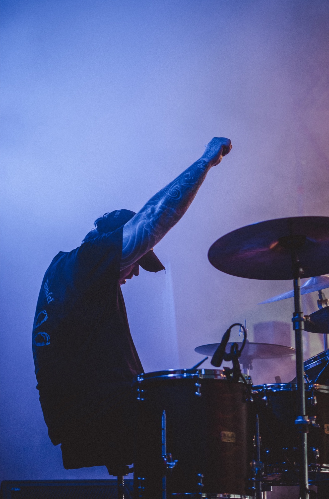 Drummer in blue stage light