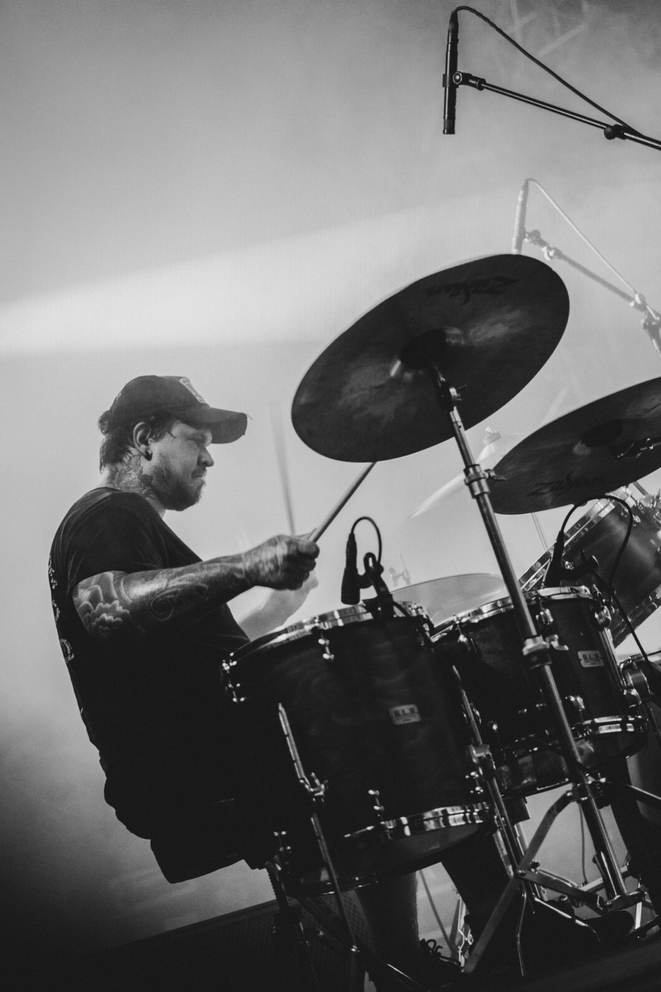 Drummer performing in black and white