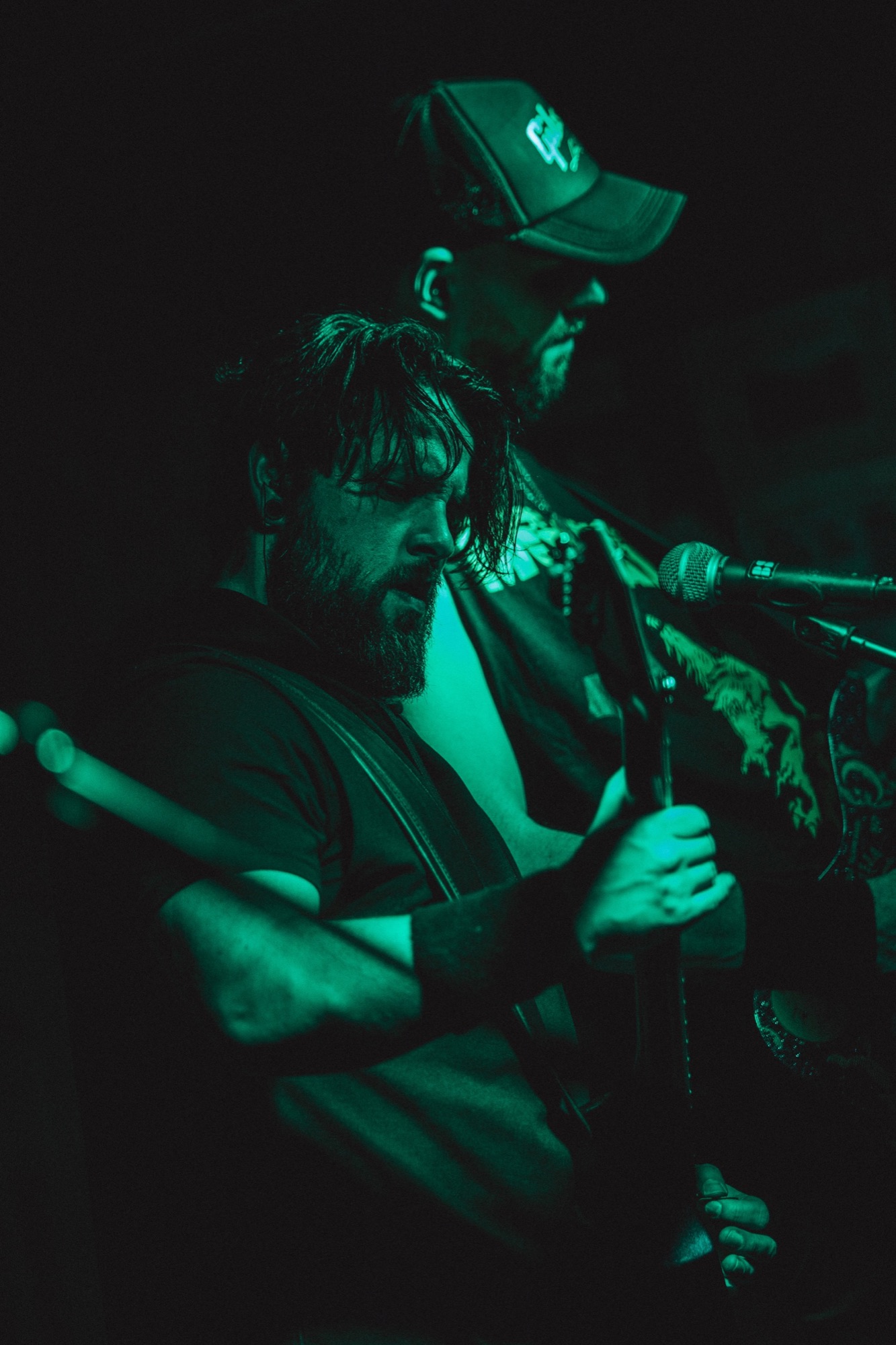 Musicians in green stage light