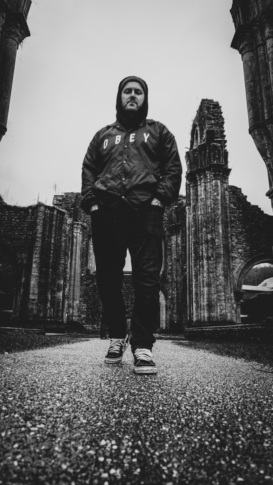 Man standing among monumental ruins
